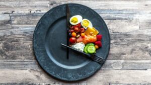 variety of food on round plate, intermittent fasting